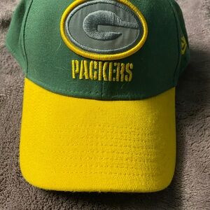 Green Bay packers ball cap.
